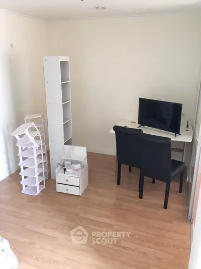 Cozy study room with modern desk and chairs, perfect for productivity.
