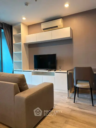 Modern living room with sleek furniture and built-in shelving, perfect for urban living.