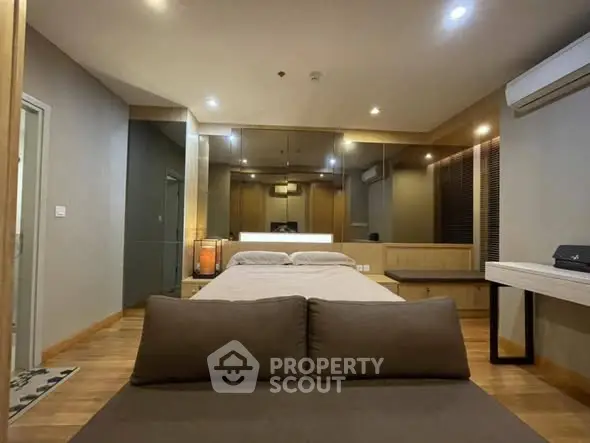 Luxurious modern bedroom with stylish decor and ambient lighting