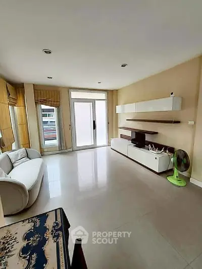 Spacious living room with modern furniture and natural light