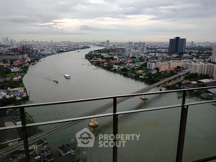Stunning river view from high-rise balcony in urban landscape