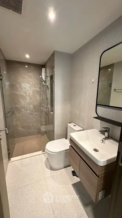 Modern bathroom with sleek design and glass shower enclosure