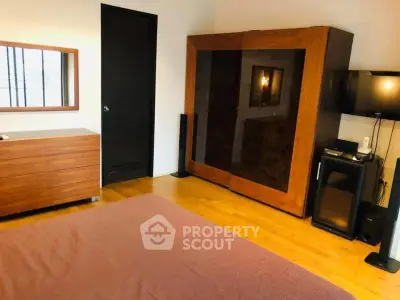 Spacious bedroom with modern wooden furniture and cozy ambiance