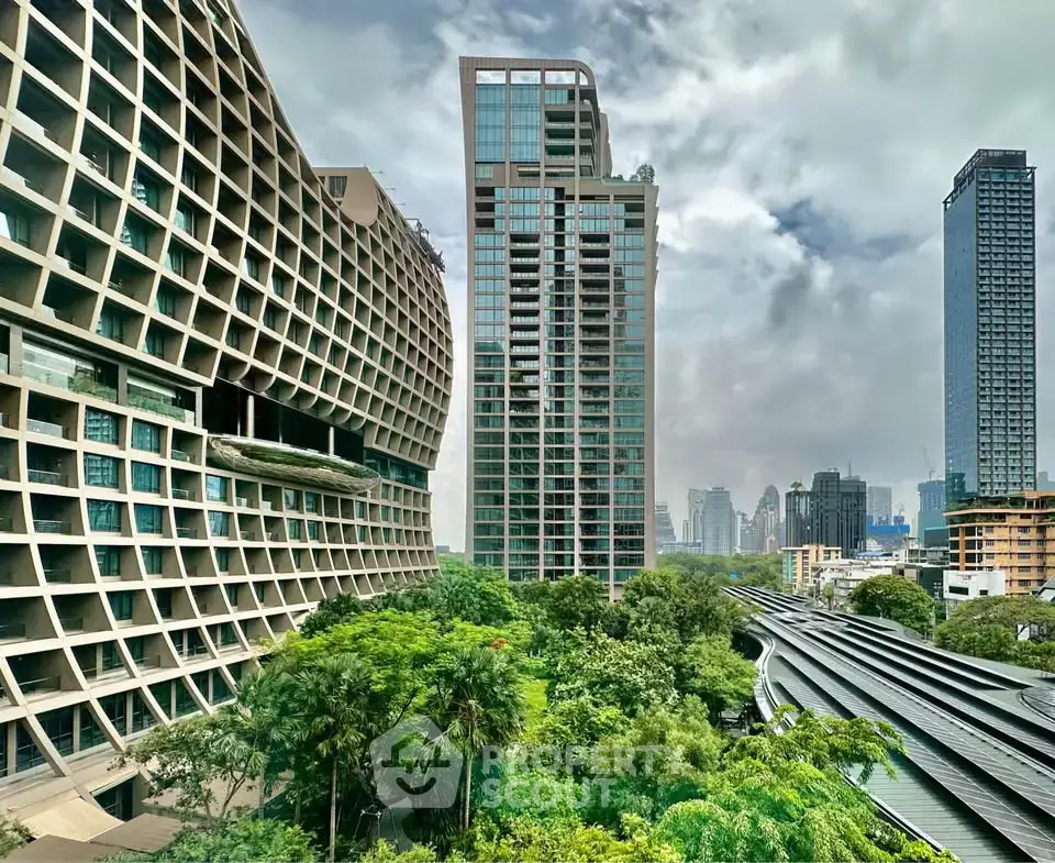 Stunning urban skyline view with modern architectural buildings and lush greenery.