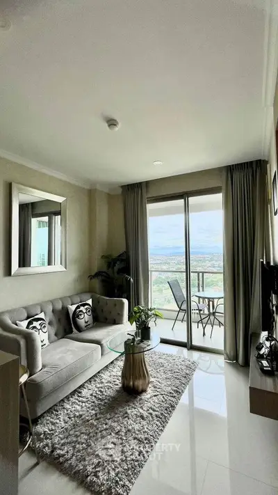 Stylish living room with balcony and scenic view in modern apartment