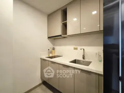 Modern kitchen with sleek cabinetry and integrated appliances