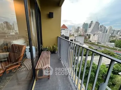 Modern balcony with city view and stylish seating area
