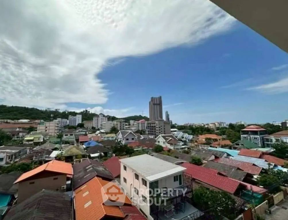 Stunning cityscape view with diverse architecture under a vibrant sky.