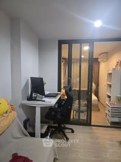 Modern study area with desk and computer in cozy apartment