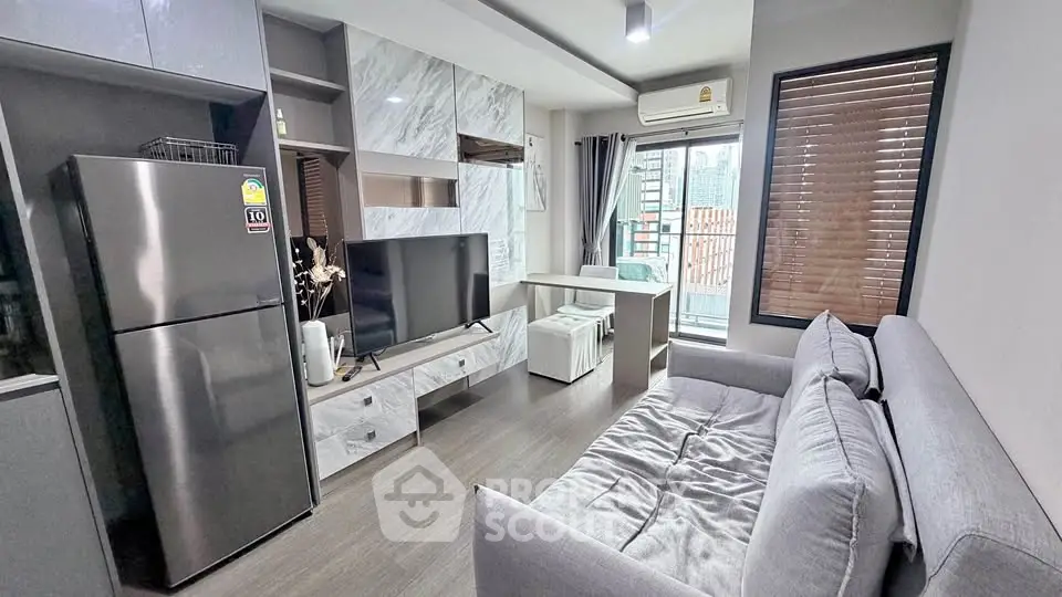 Modern living room with sleek design, featuring a cozy sofa, flat-screen TV, and stylish marble accents.
