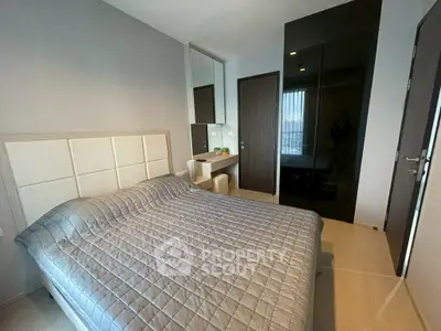 Modern bedroom with sleek black wardrobe and stylish decor