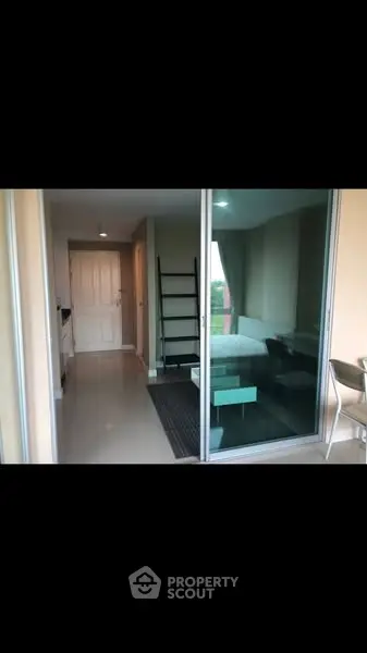 Modern apartment with sliding glass doors and sleek interior design