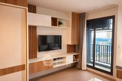 Modern living room with built-in TV unit and balcony view