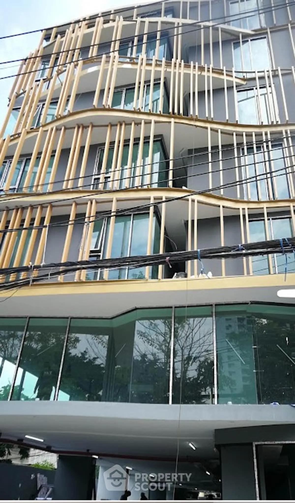 Modern architectural building with unique facade design and large glass windows