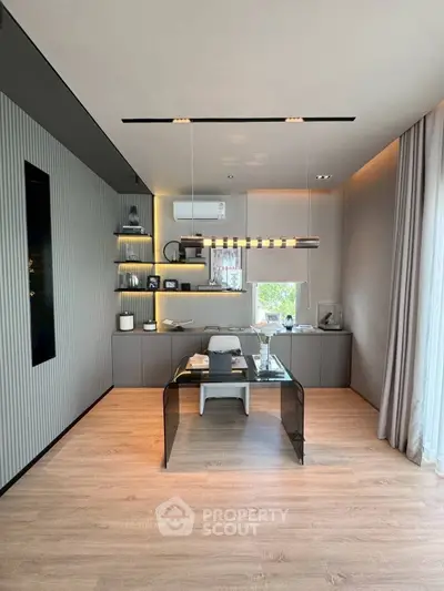 Modern study room with sleek design and natural light, featuring a stylish desk and contemporary decor.