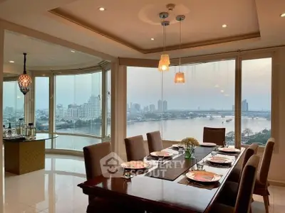 Luxurious dining room with panoramic river view and elegant decor