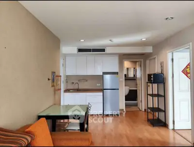 Modern apartment interior with open kitchen and cozy living area