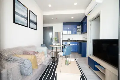 Modern living room with open kitchen and stylish decor