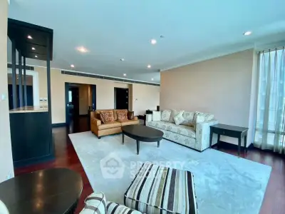 Spacious living room with elegant decor and ample natural light