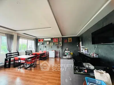 Spacious modern living room with stylish decor and large windows