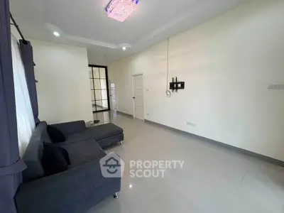 Spacious living room with modern sofa and elegant lighting