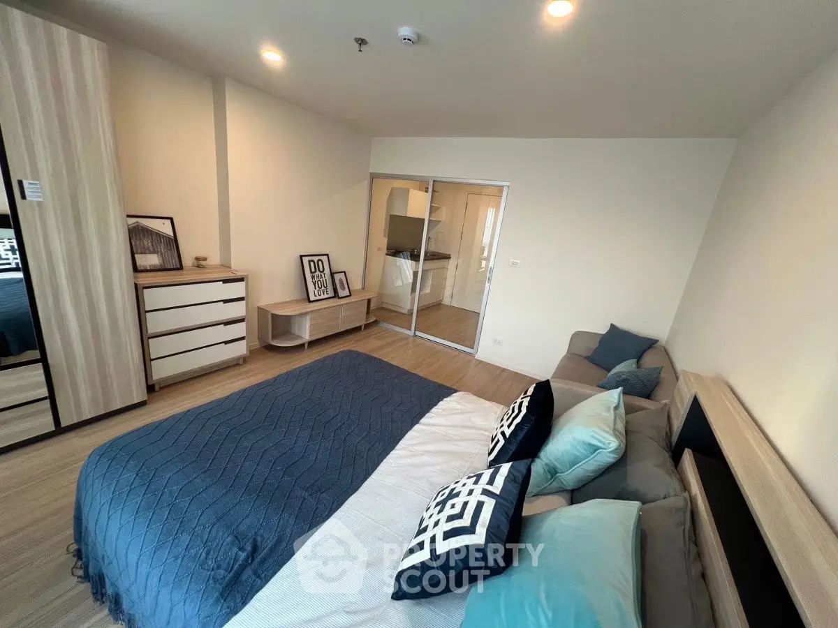 Spacious modern bedroom with stylish decor and cozy ambiance