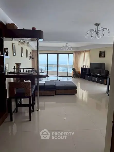 Spacious living room with ocean view and modern furnishings