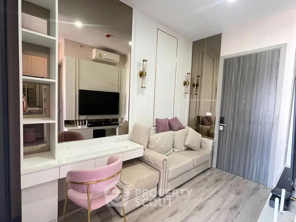 Modern living room with stylish decor and cozy seating in a contemporary apartment.