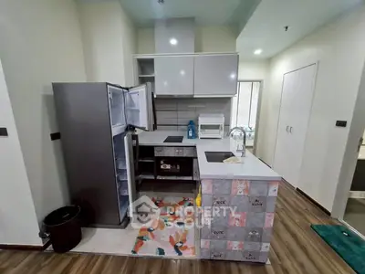 Modern kitchen with open fridge and stylish decor in cozy apartment