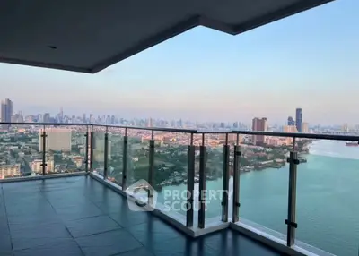 Stunning high-rise balcony with panoramic city and river views, perfect for urban living.