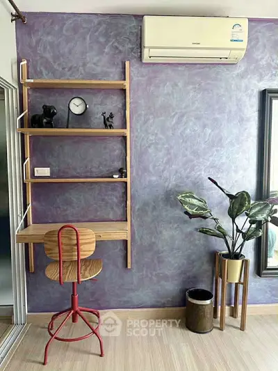 Modern study nook with wooden desk, air conditioning, and stylish decor