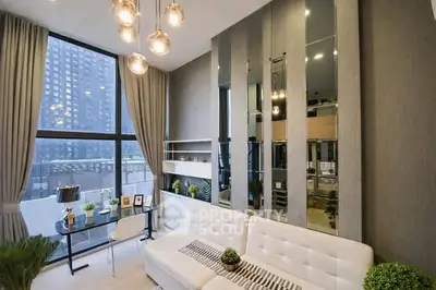 Modern living room with floor-to-ceiling windows and stylish decor in a high-rise apartment.