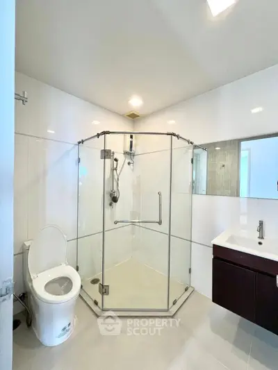 Modern bathroom with glass shower and sleek fixtures