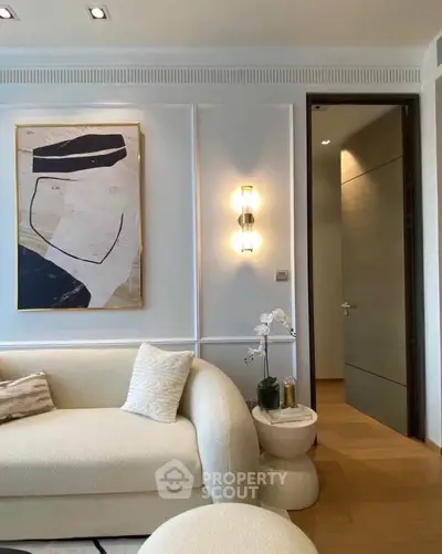 Elegant living room with modern art and cozy sofa, perfect for stylish urban living.