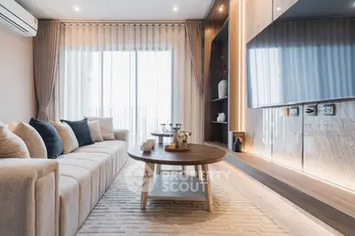 Luxurious modern living room with elegant decor and large TV