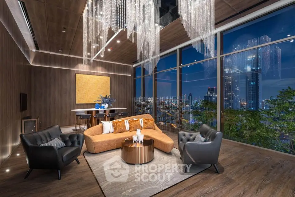 Luxurious living room with stunning city view and elegant chandelier lighting.