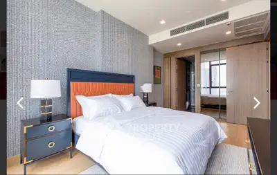 Luxurious modern bedroom with stylish decor and elegant furnishings in a high-end apartment.