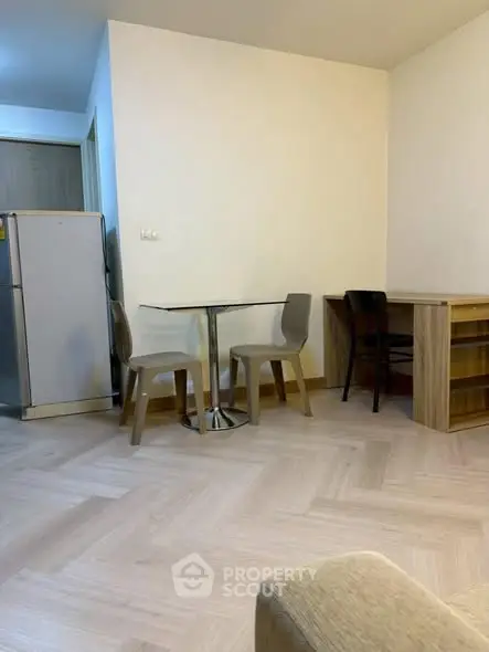 Cozy apartment interior with dining area and modern furniture.