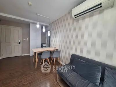 Modern living room with stylish decor and air conditioning in a cozy apartment.