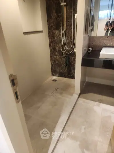 Modern bathroom with sleek shower and elegant marble accents