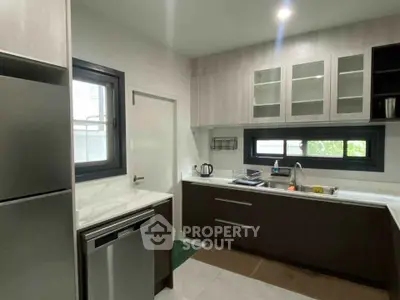 Modern kitchen with sleek cabinetry and stainless steel appliances