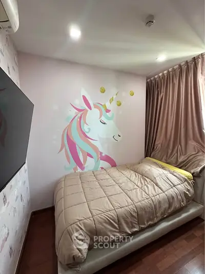 Charming bedroom with unicorn wall art and cozy bedding, perfect for a child's dream space.