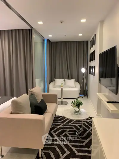 Modern living room with stylish decor and cozy seating area in a contemporary apartment.
