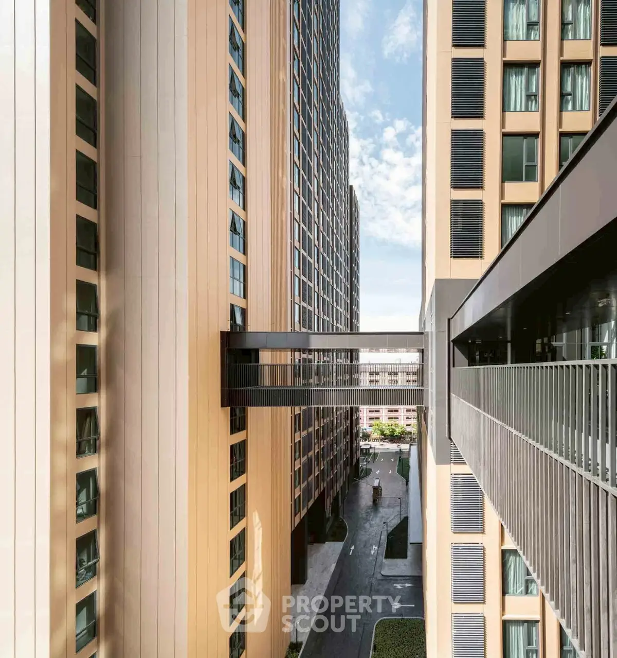 Modern high-rise building with skybridge and urban view