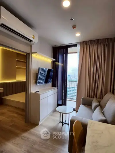 Modern living room with city view, featuring sleek furniture and ambient lighting.