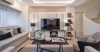 Modern living room with stylish decor and elegant lighting