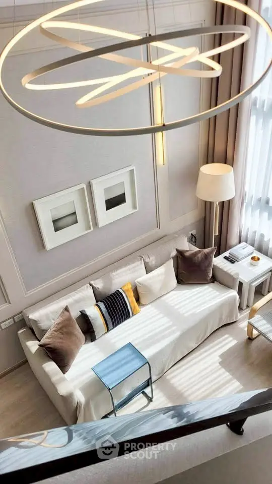 Modern living room with stylish decor and elegant lighting