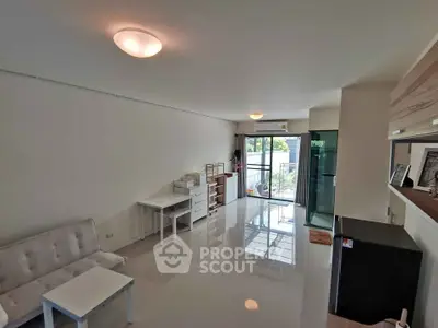 Spacious modern living room with sleek design and ample natural light