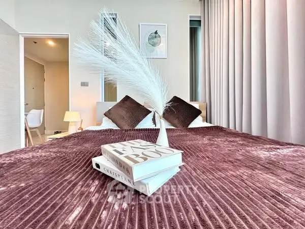 Luxurious bedroom with plush bedding and elegant decor, perfect for relaxation.