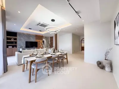 Spacious modern living and dining area with elegant decor and ambient lighting